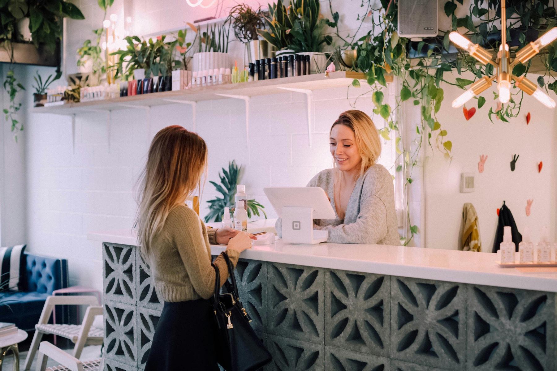 A customer being welcomed into an independent shop
